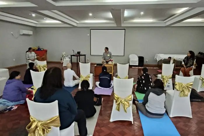 The class in session — small enough that every question gets heard.